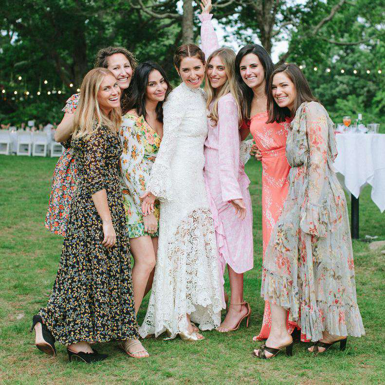 wedding guests in dresses, tights and heels