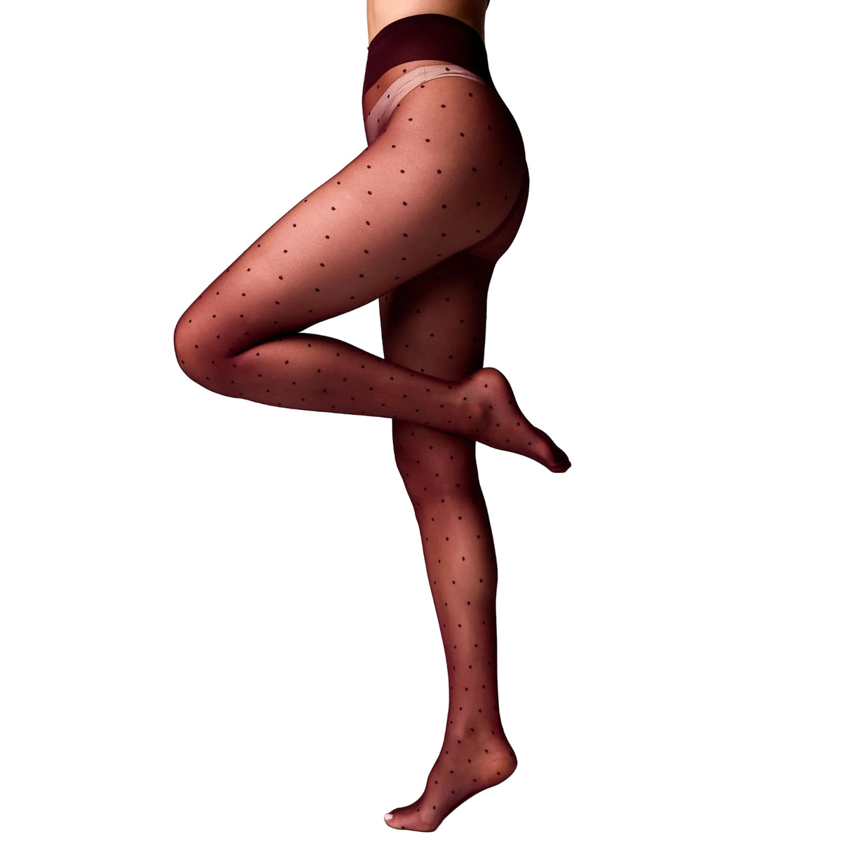 A model's lower body wearing sheer dark red tights with a small black polka dot pattern, posed against a clean white studio background.