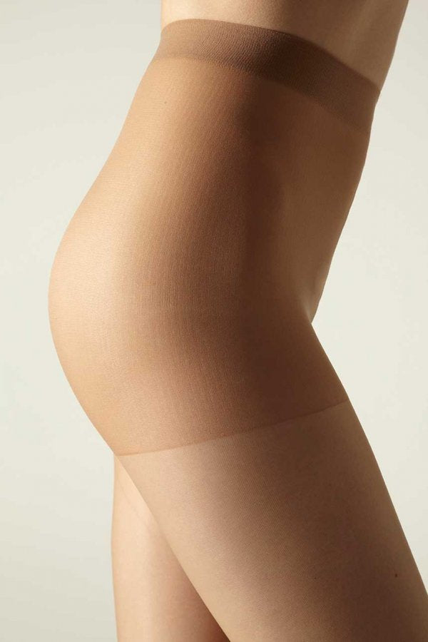 Matt tights being worn by a model on a neutral background