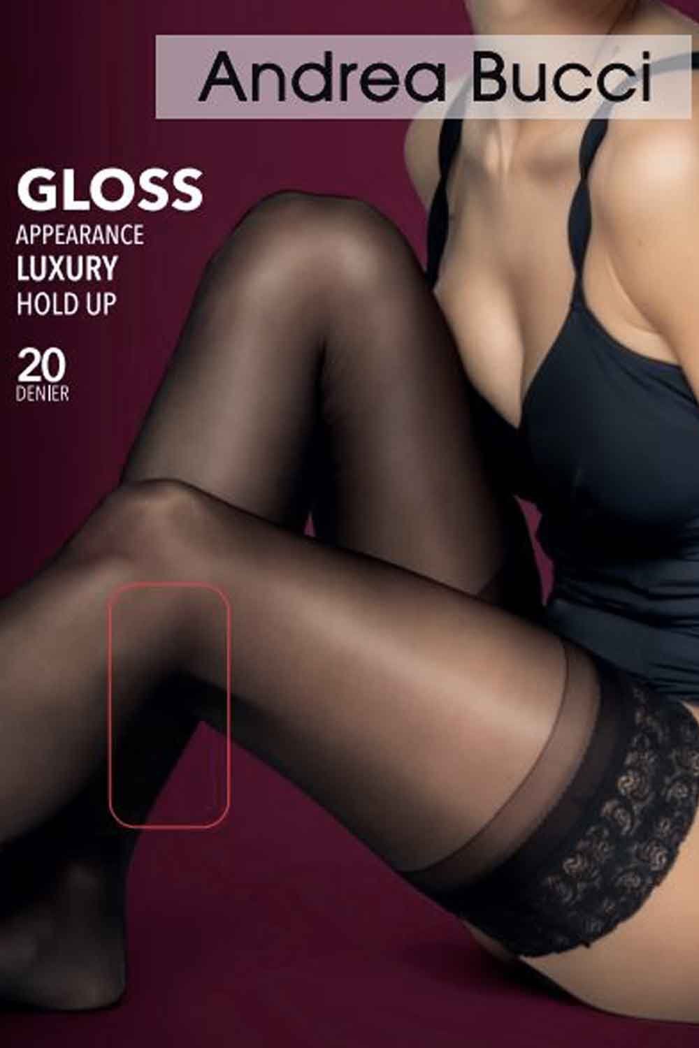 Person wearing black hold ups  with Andrea Bucci branding on a maroon background