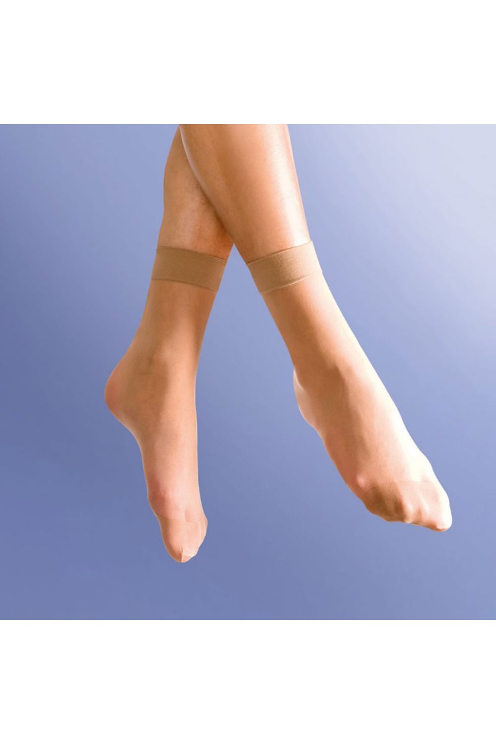 Close-up of legs wearing  smooth knit natural tan anklets against a light blue background