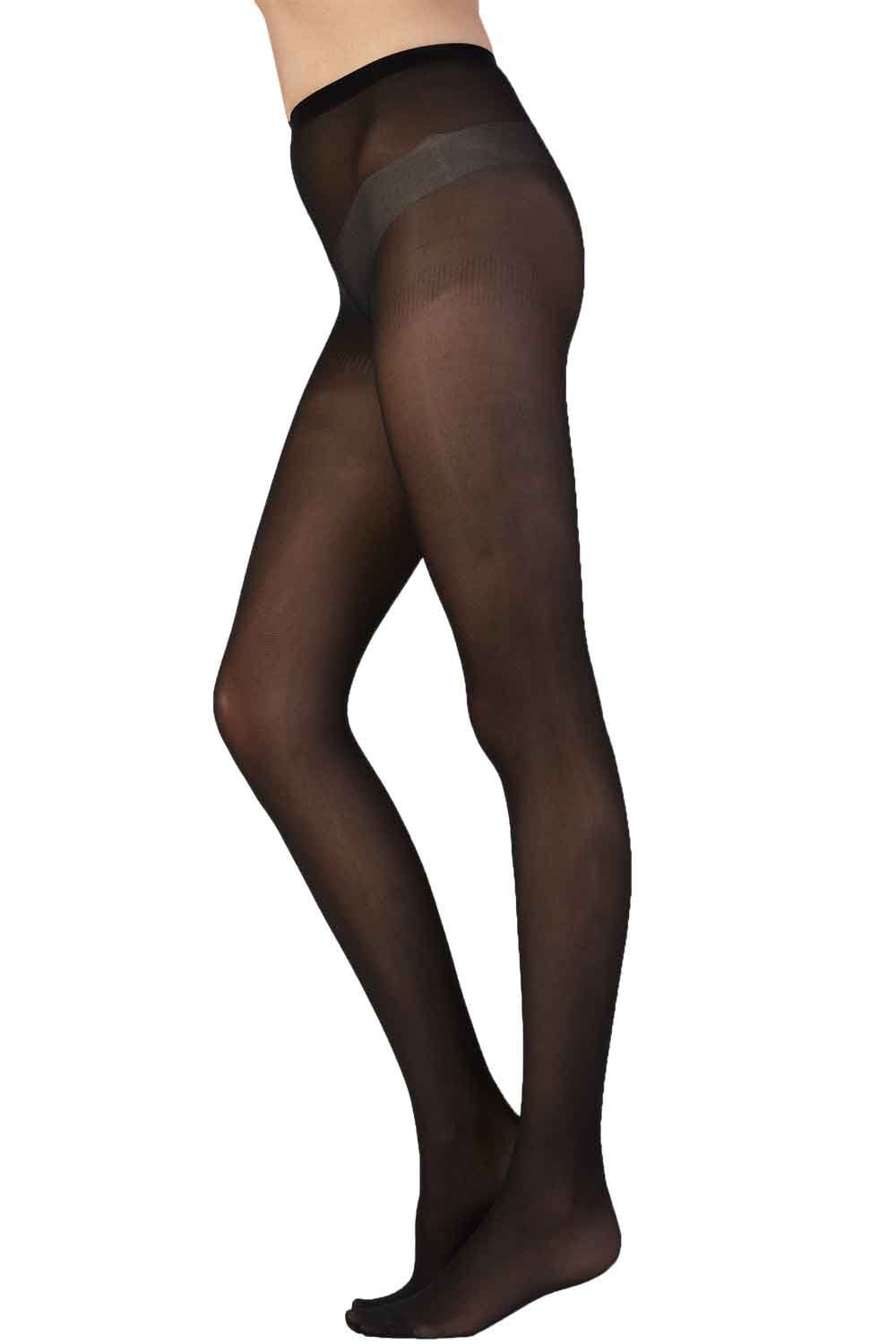 Navy tights worn by a person on a white background