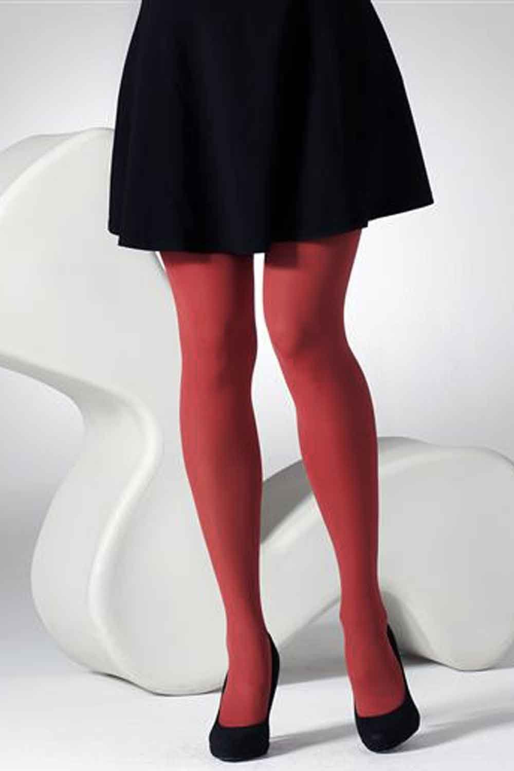 Model wearing  tights and black shoes on a white background