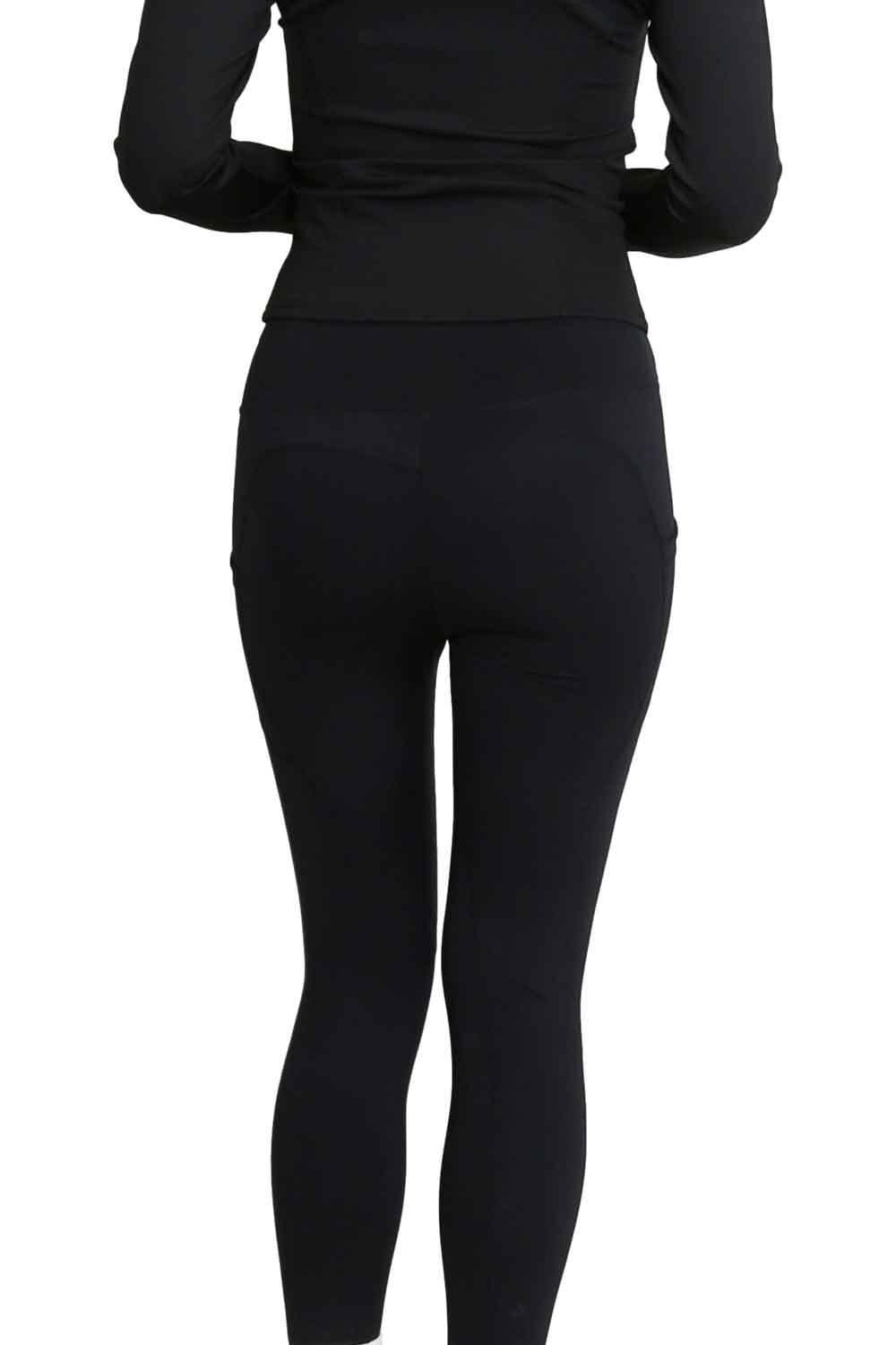 Model  wearing black leggings on a white background