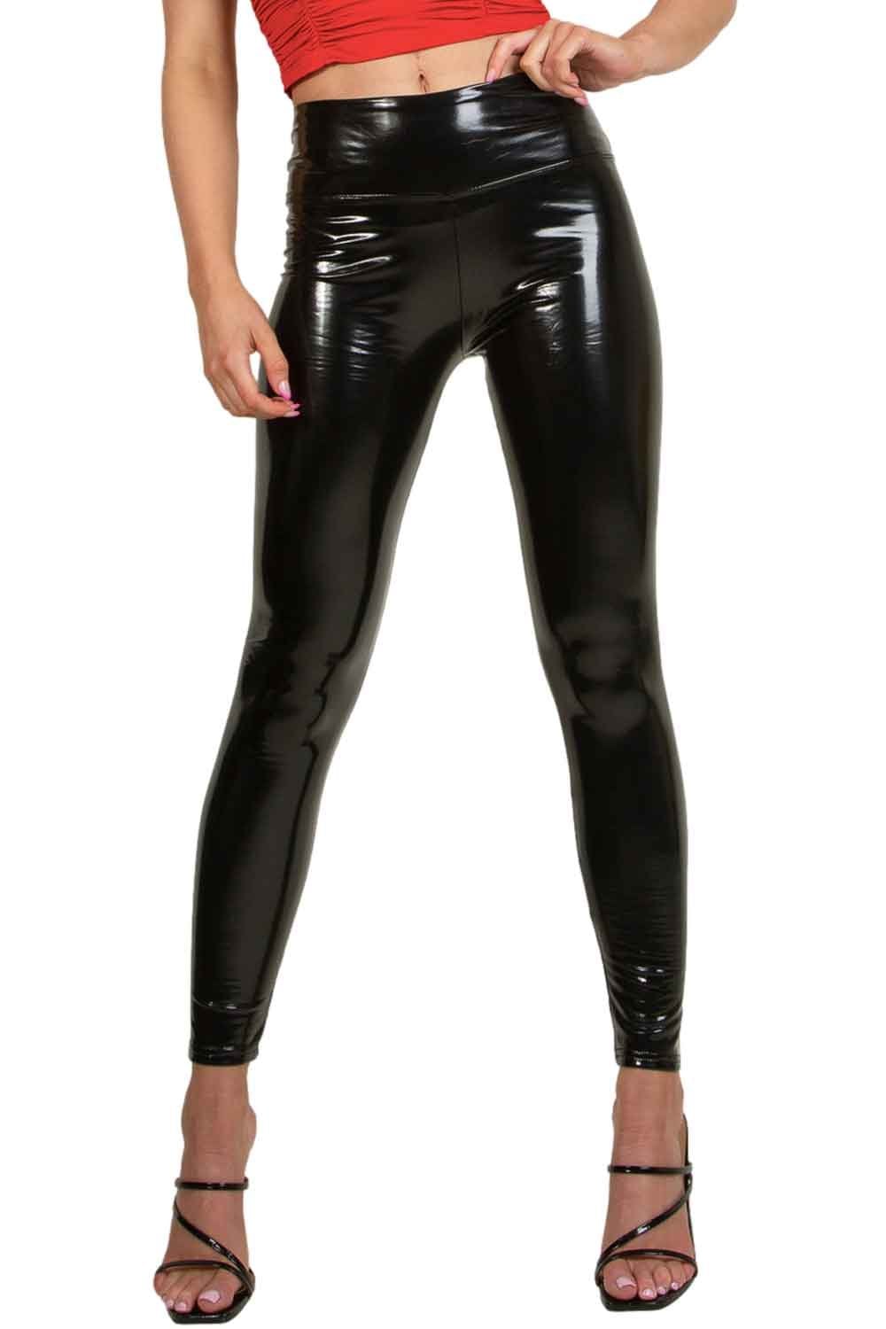 Model  wearing shiny black vinyl  leggings on a white background