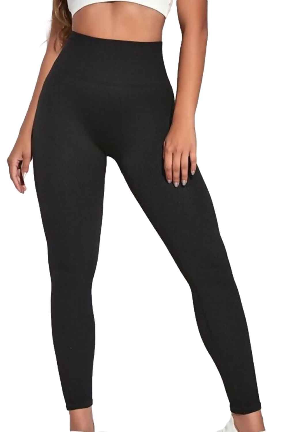 Black ribbed leggings worn by a model on a white background