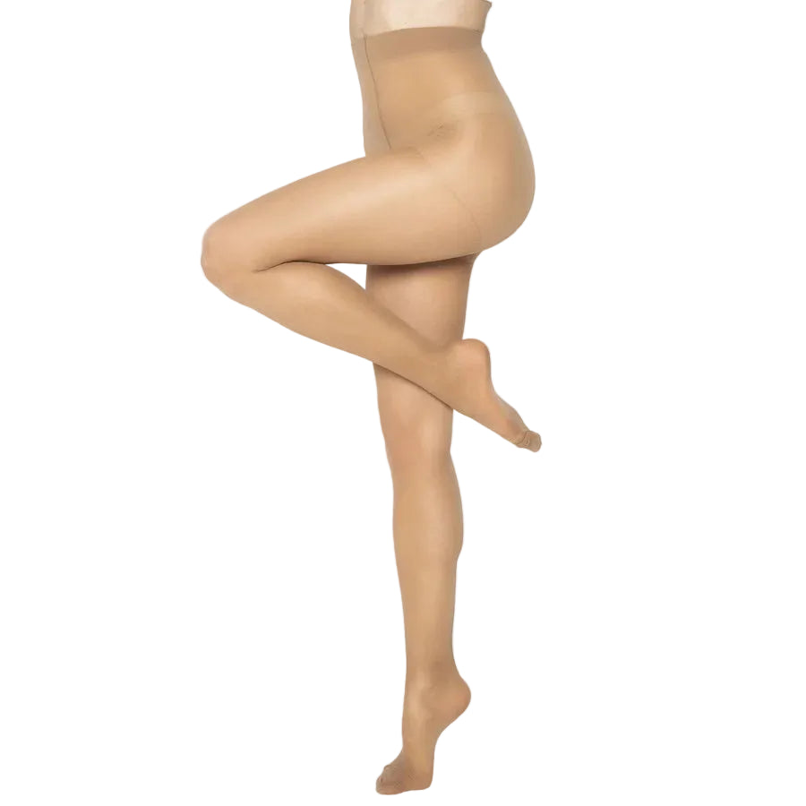 Model wearing natural coloured support tights against a white background