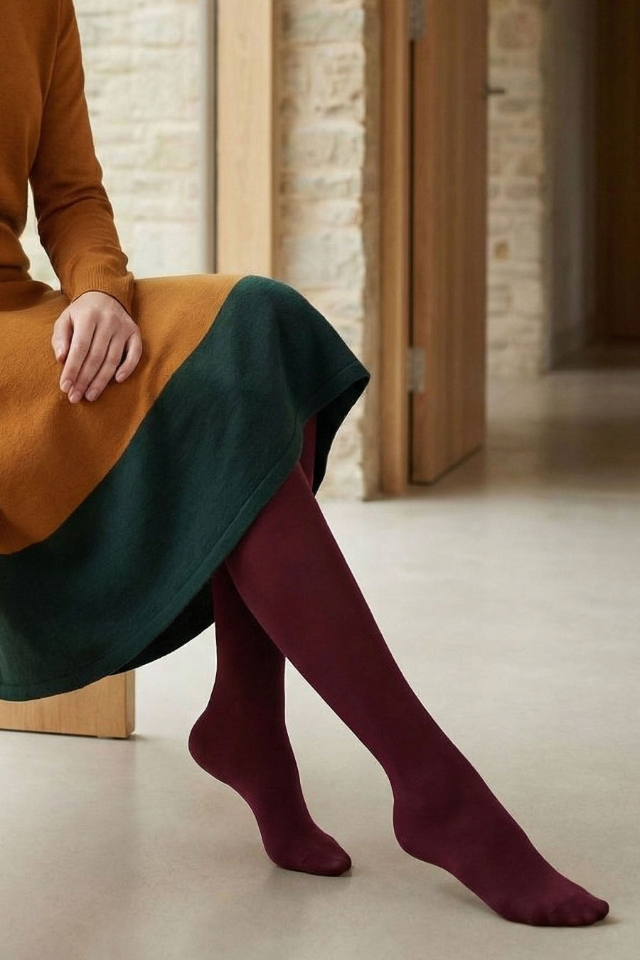 Person wearing 60 denier cherry tights with a yellow and green jumper dress
