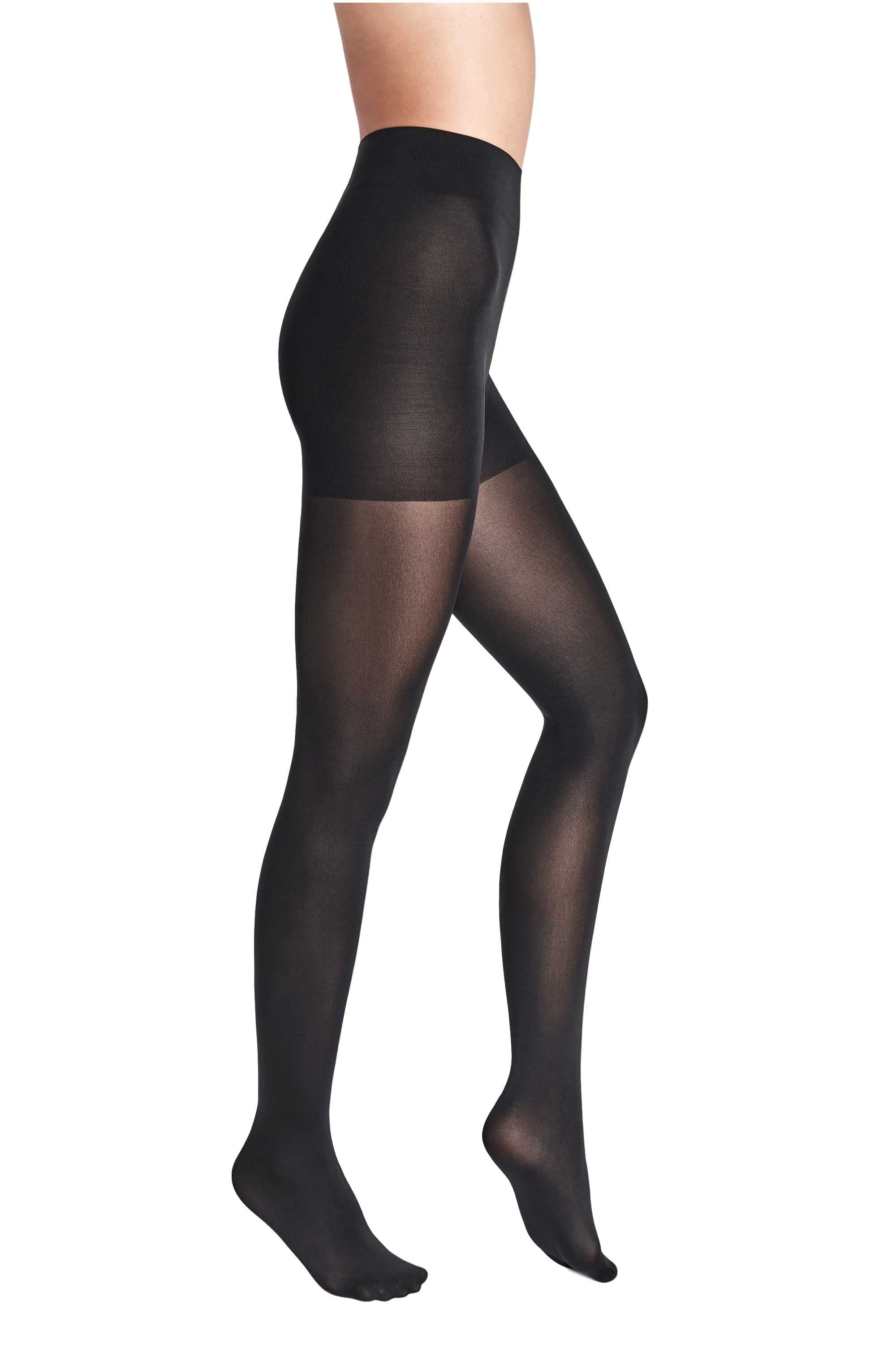Black tights worn by a person on a white background