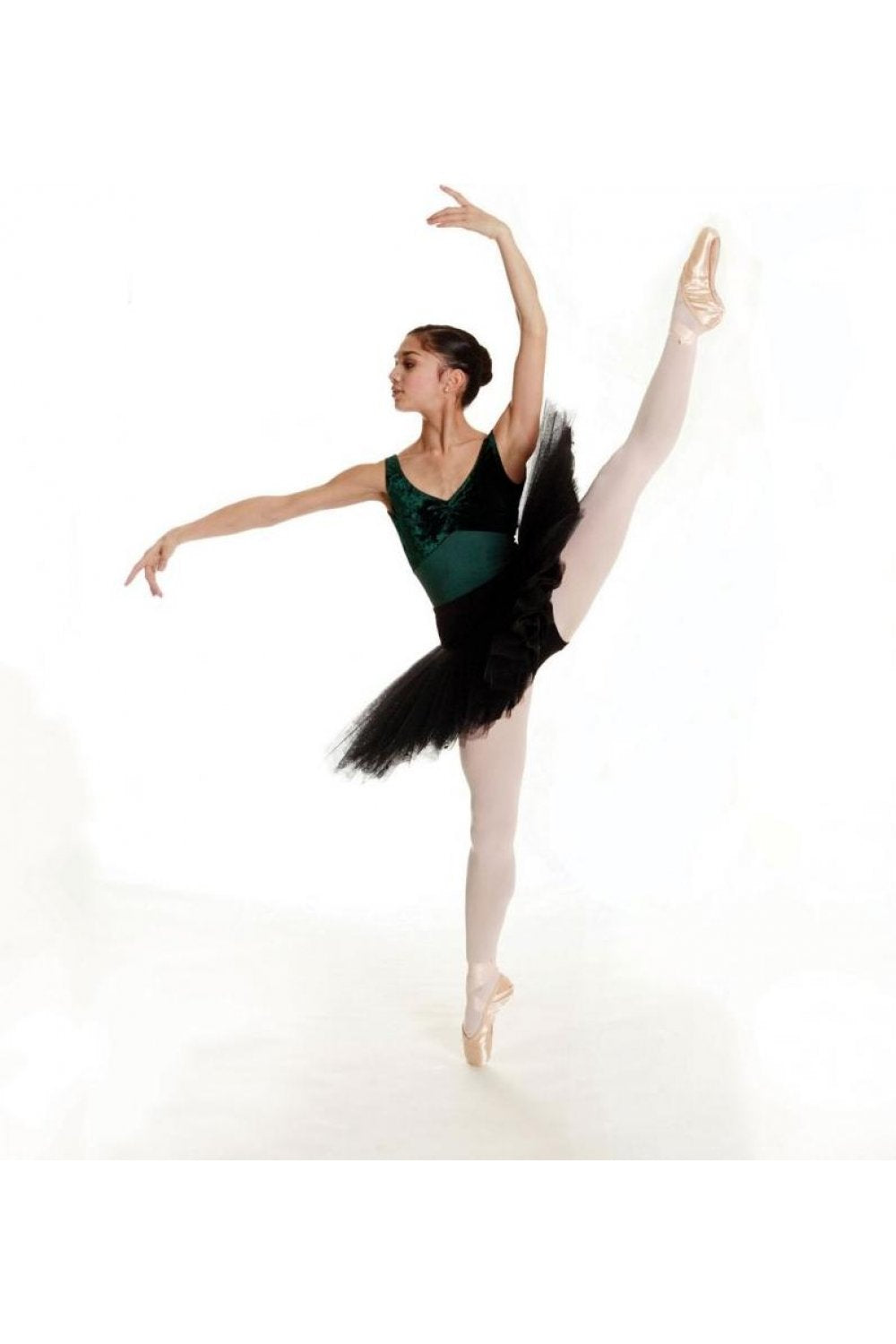 Ballerina wearing full foot dance tights with a white background