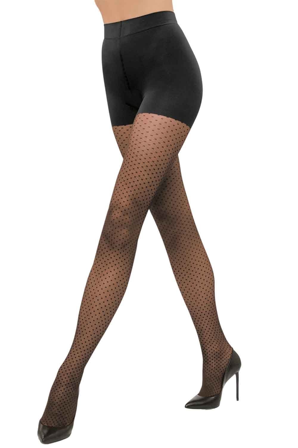 Black control dot tights  worn with black high heels on a white background