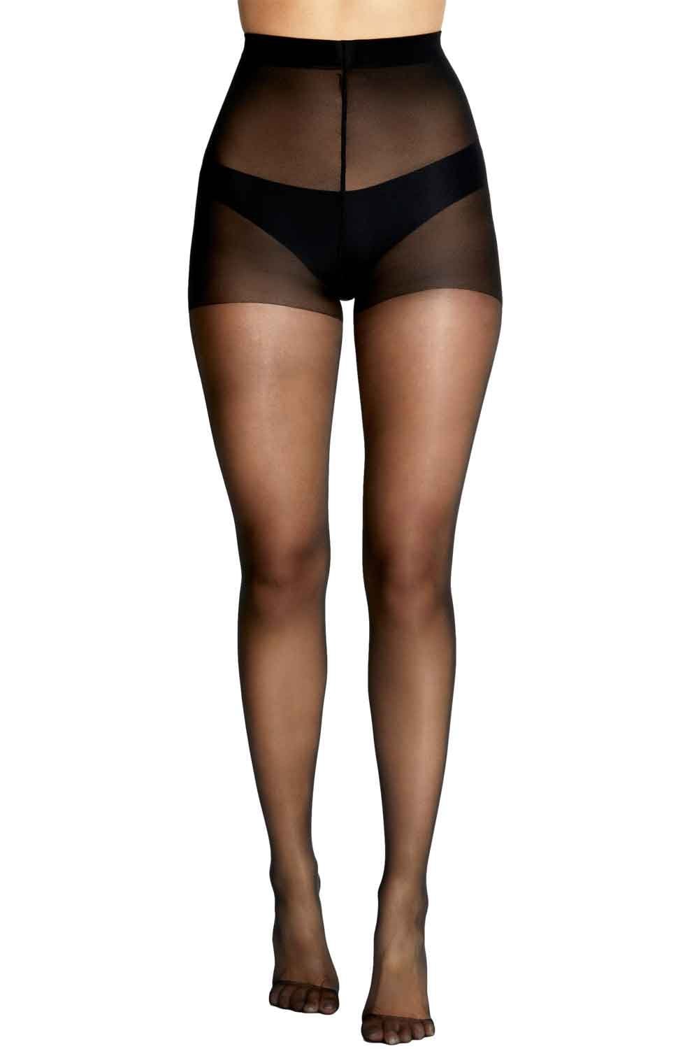 Black tights worn by a model on a white background