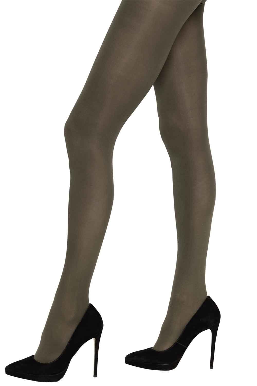 Charnos dark green tights worn by a person with black high heels on a white background