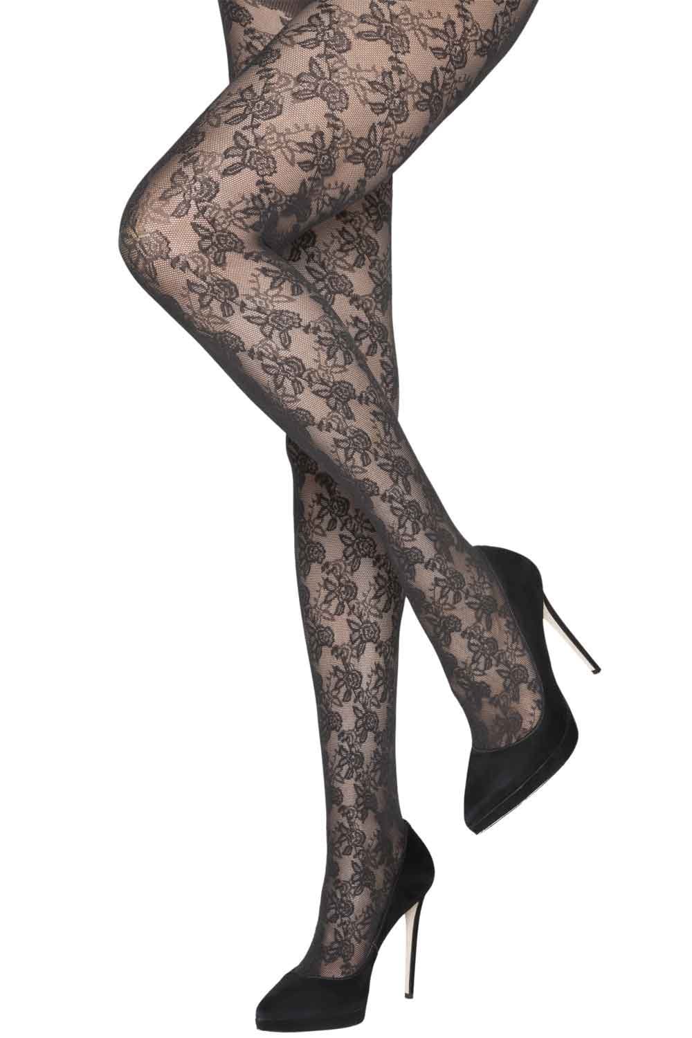 Black floral  lace tights worn with black high heels on a white background