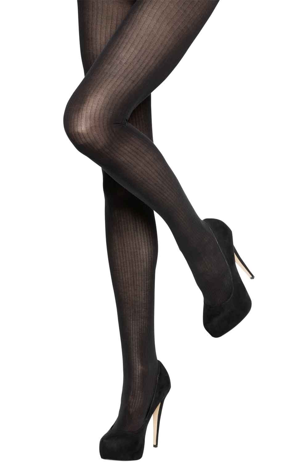 Rib tights worn with black high heels on a white background