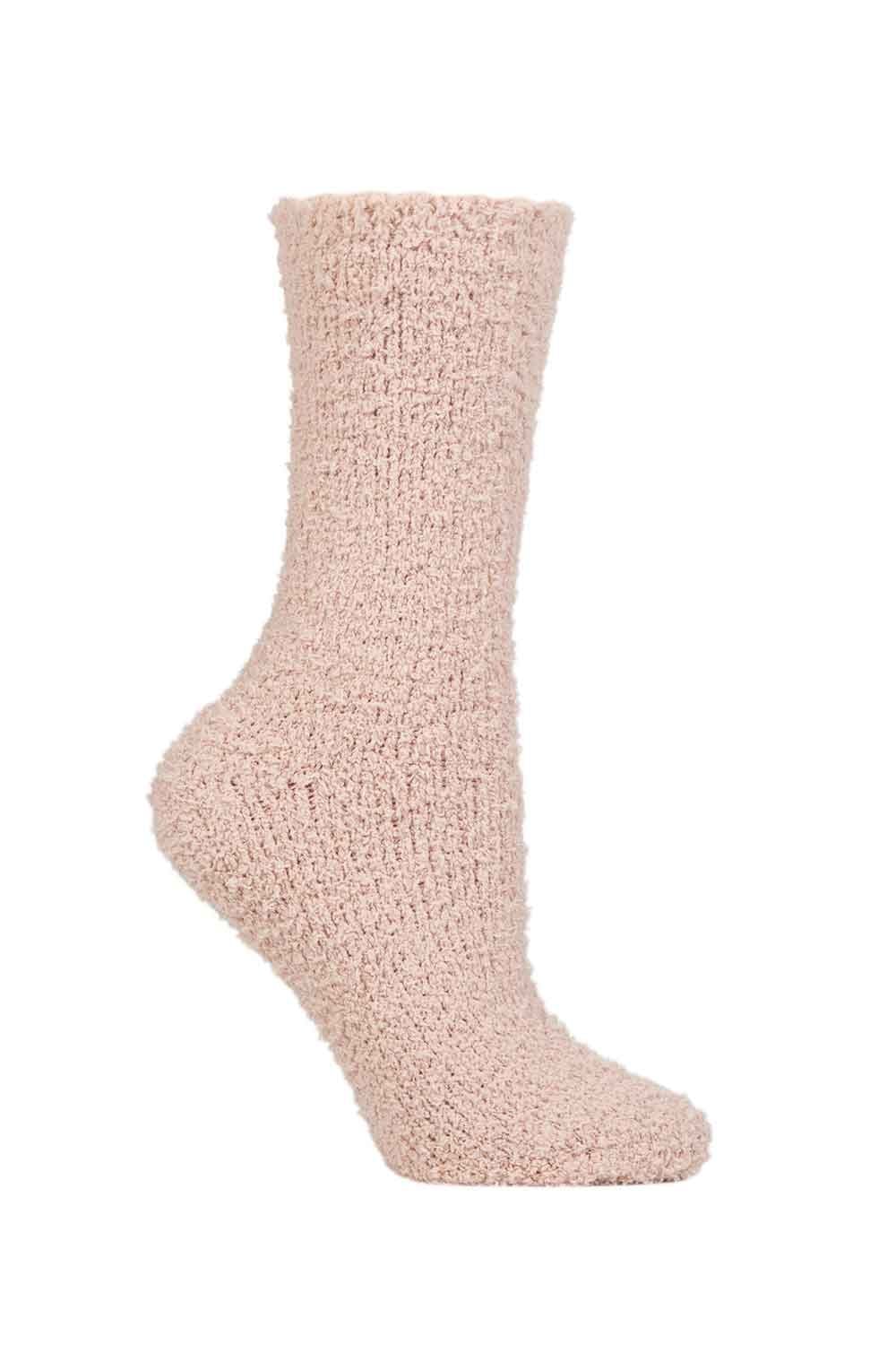 Peach  fuzzy sock on a white background