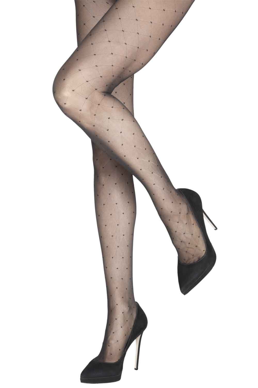 Charnos black polka dot diamond pattern tights worn with black high heels on a white background