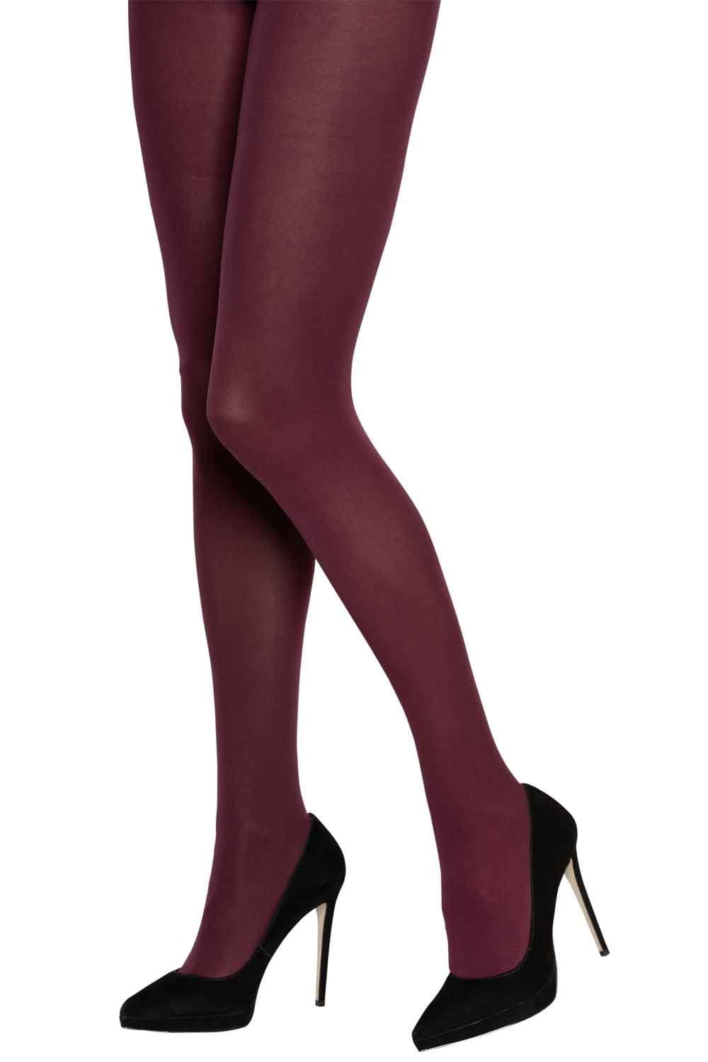 Charnos bordeaux tights worn by a person with black high-heeled shoes on a white background