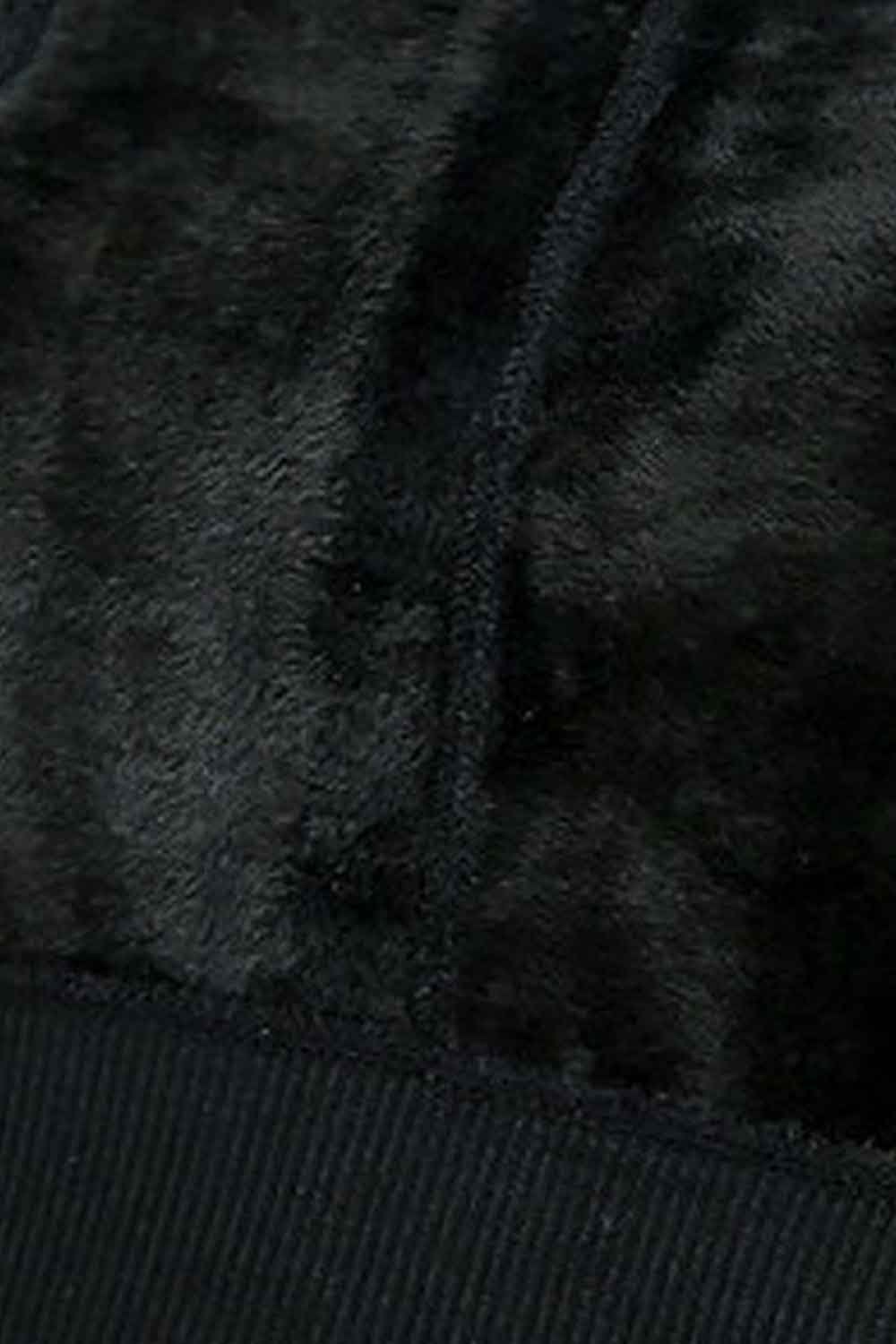 Close-up of dark fleece lined  fabric texture of inside the footless tights