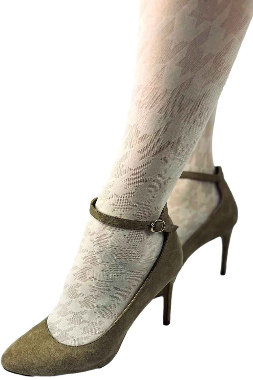 Green high-heeled shoe with a strap worn over cream patterned tights on a white background