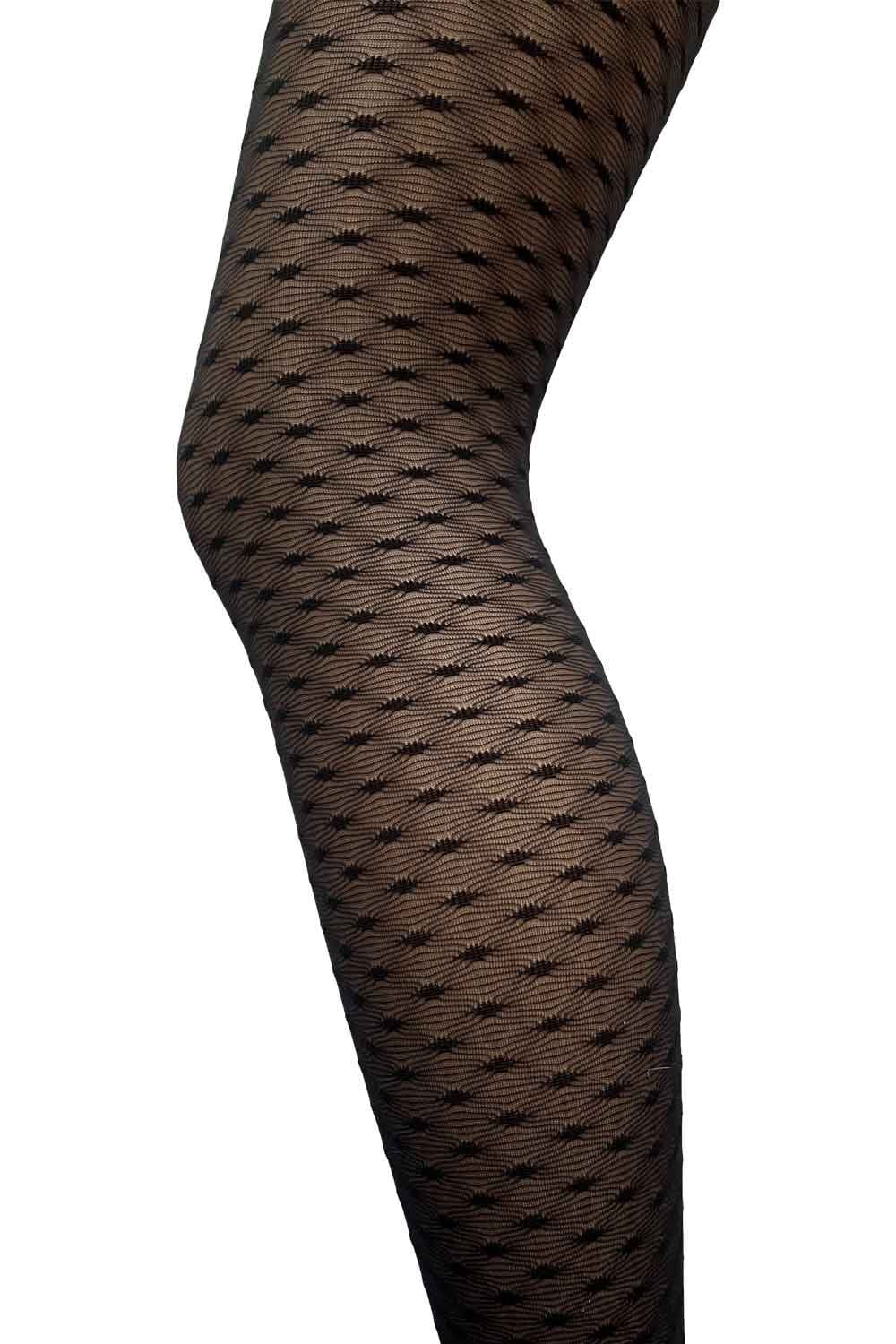 Black lace effect patterned tights on a white background