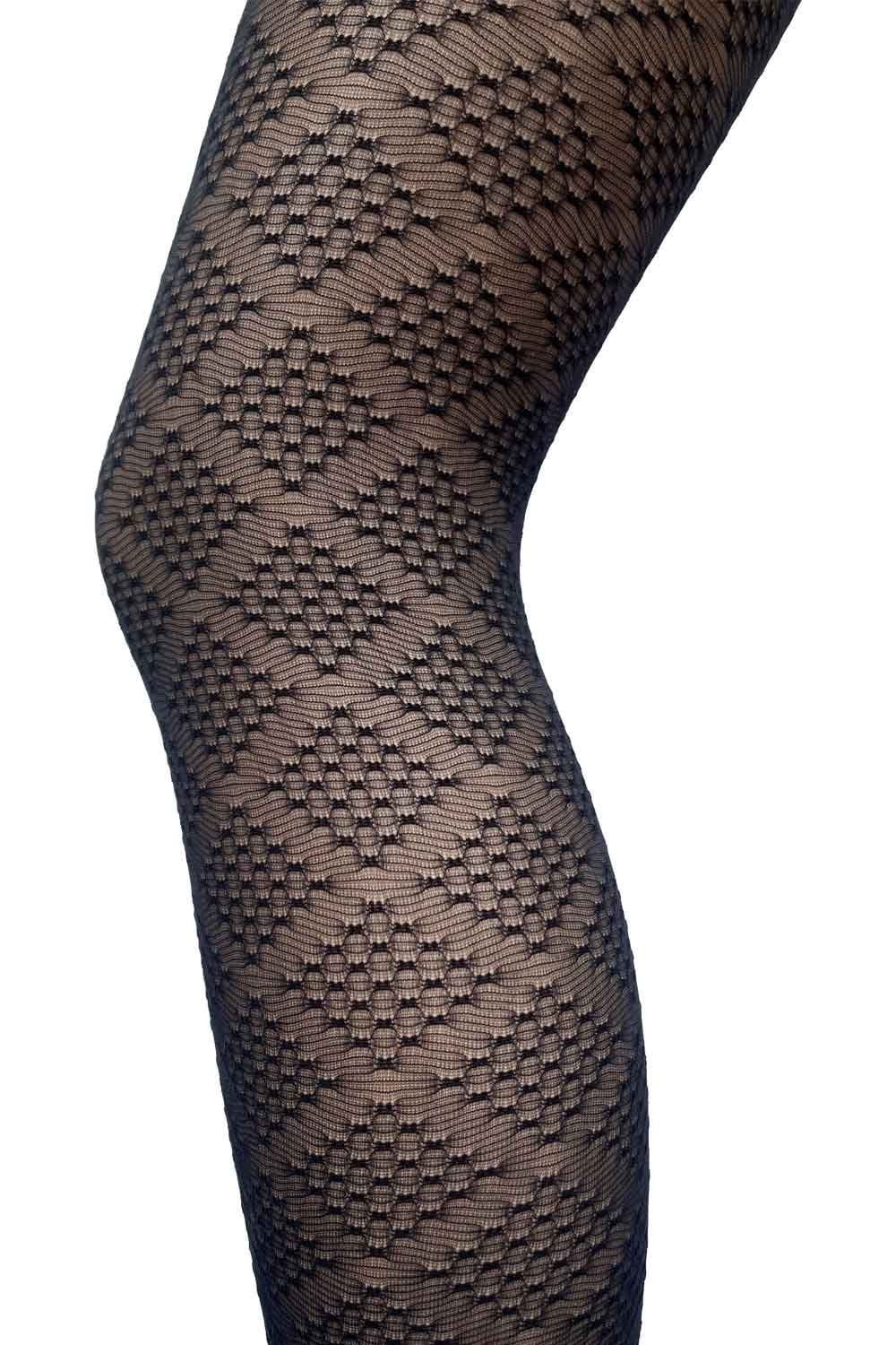 Black diamond patterned  tights on a white background