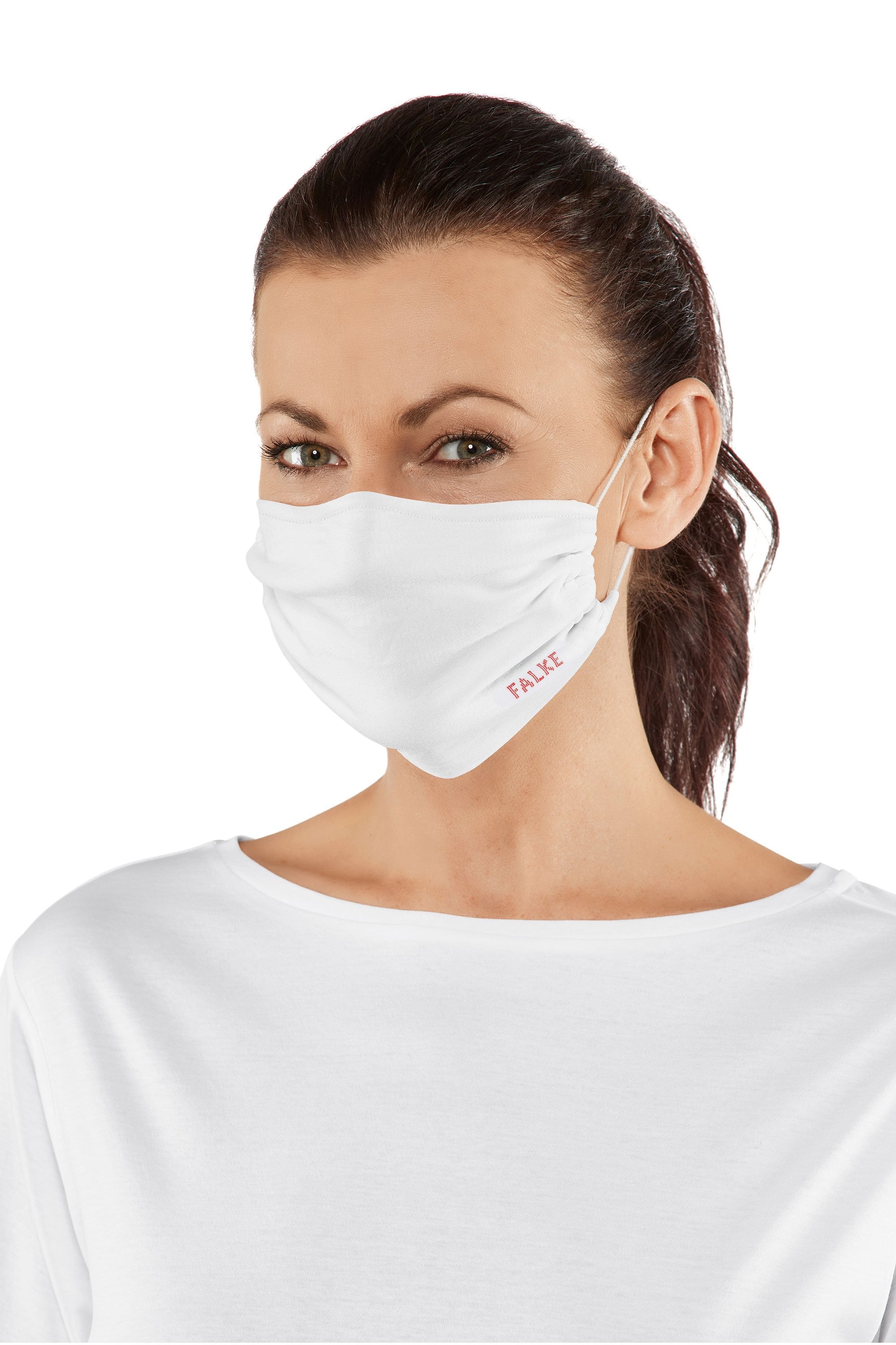 Woman wearing a white face mask with a visible brand logo on a white background