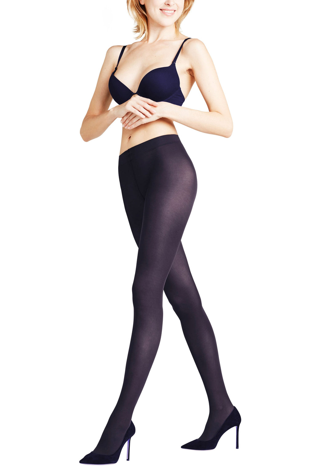 Woman wearing marine coloured  tights and high heels on a white background