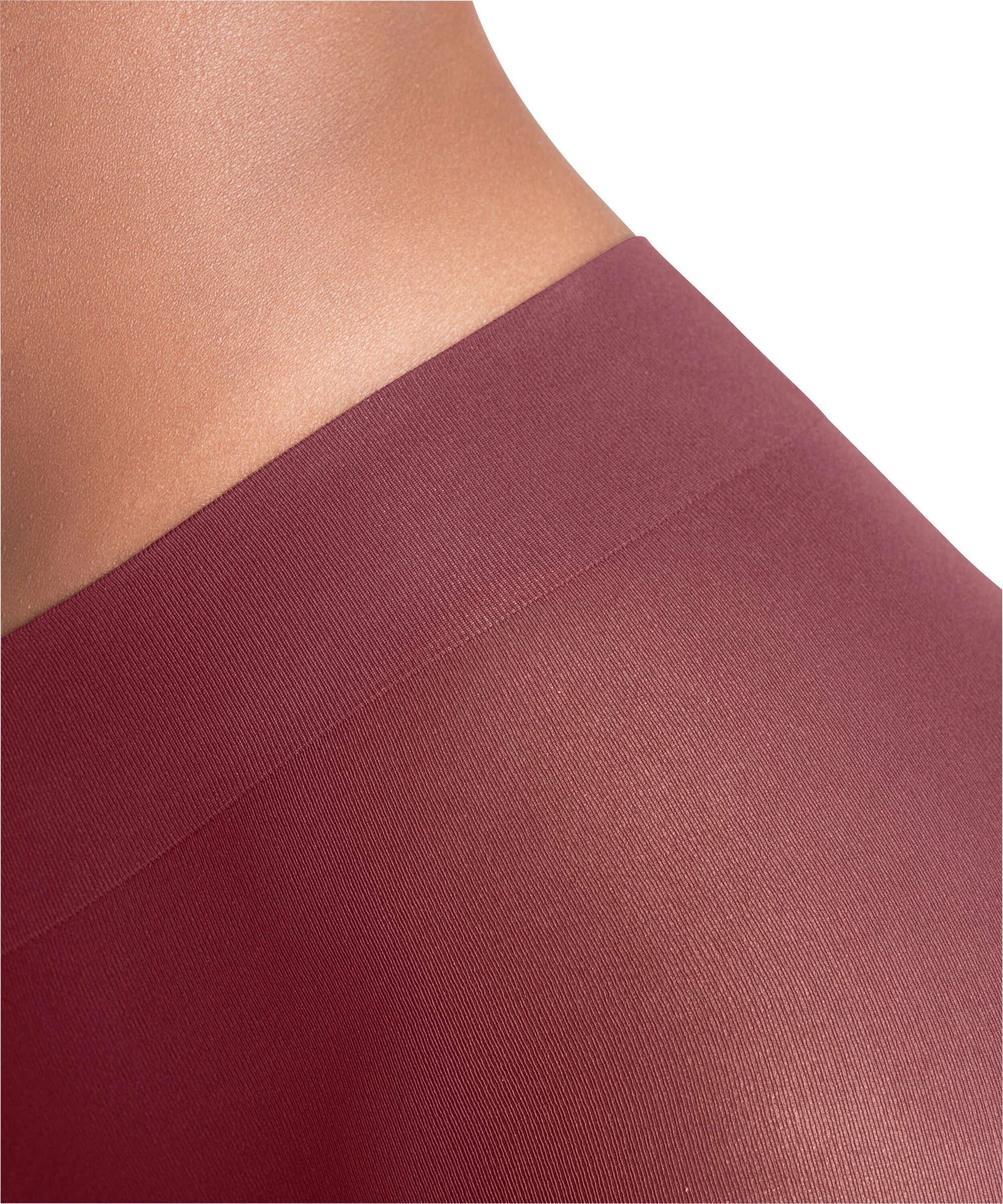 Close-up of a ruby coloured tights with a plain background