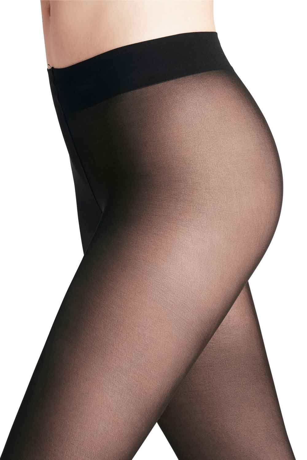 Black sheer tights worn by a person on a white background