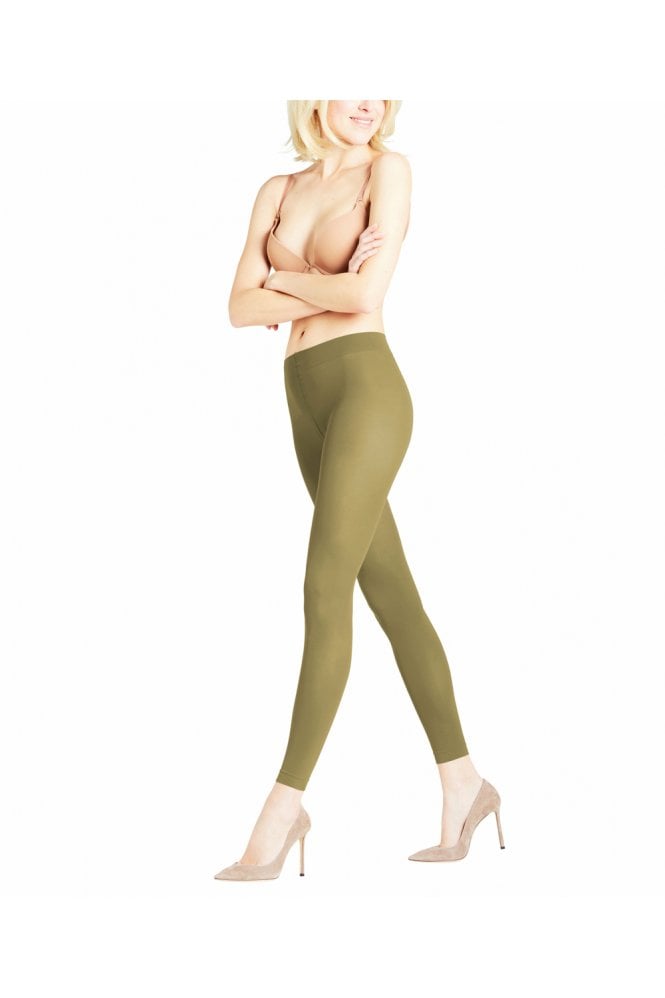 Person wearing olive green leggings on a white background