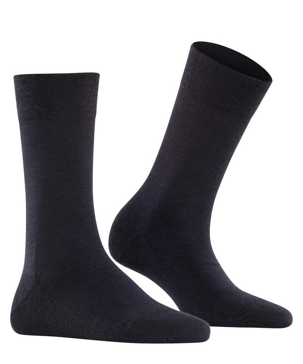 Pair of dark navy socks on a white background