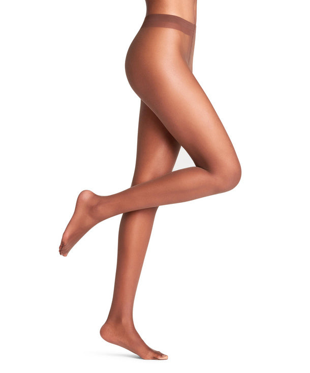 Espresso coloured  sheer tights worn by a model on a white background