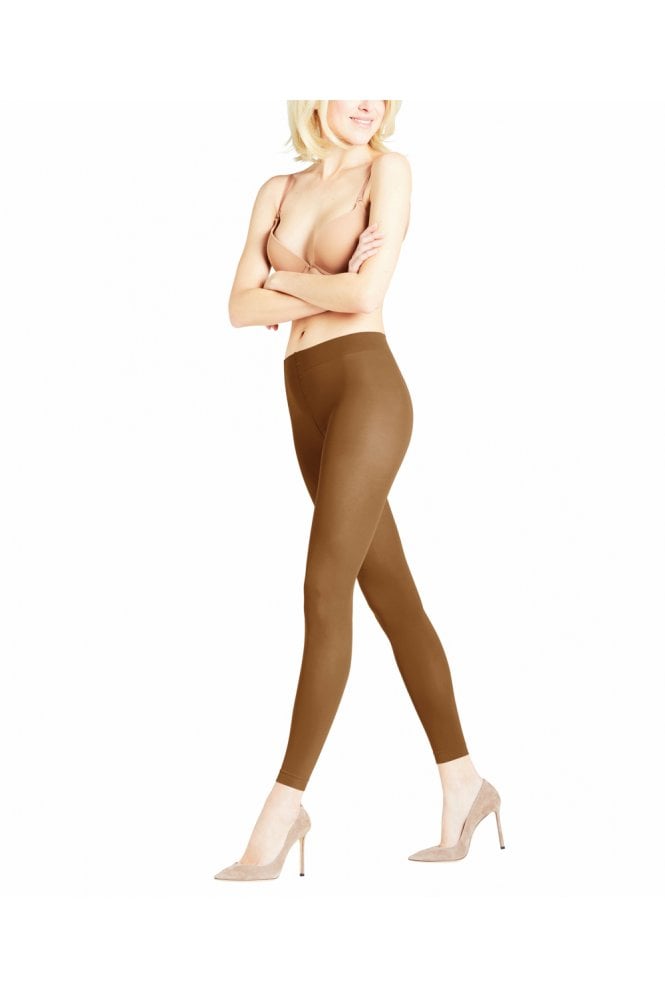 Woman wearing toffee coloured leggings  on a white background