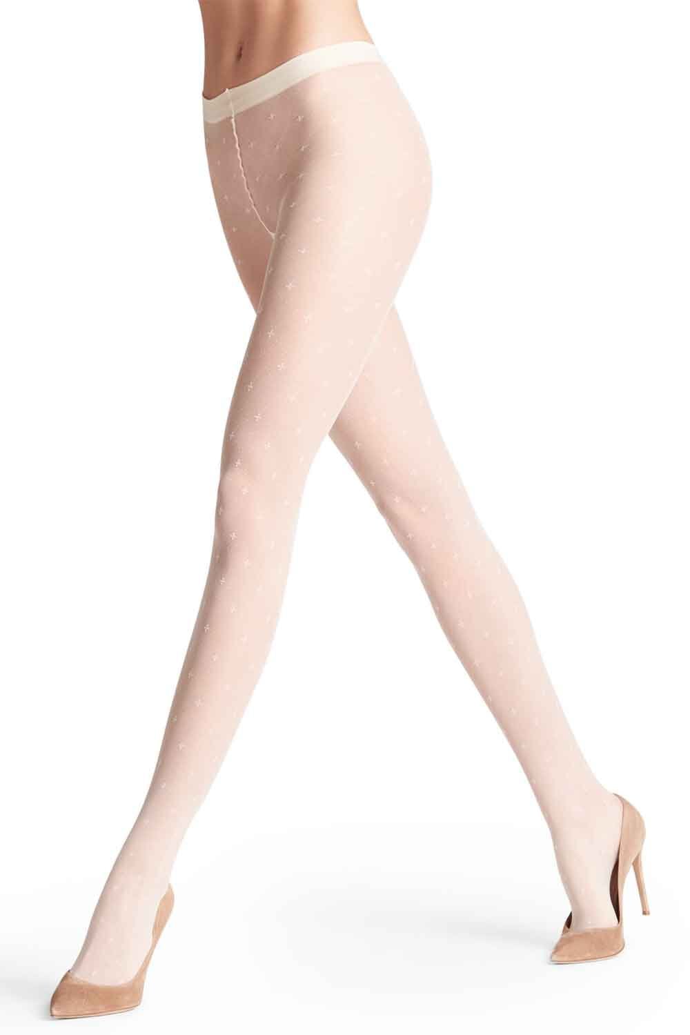 Champagne coloured tights worn by a model on a white background 