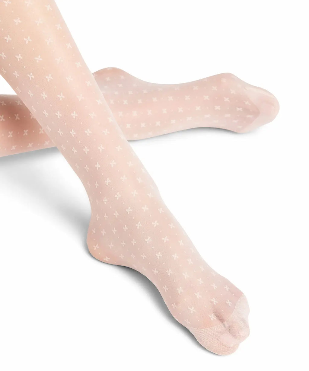 close up of foot of falke bow patterned tights
