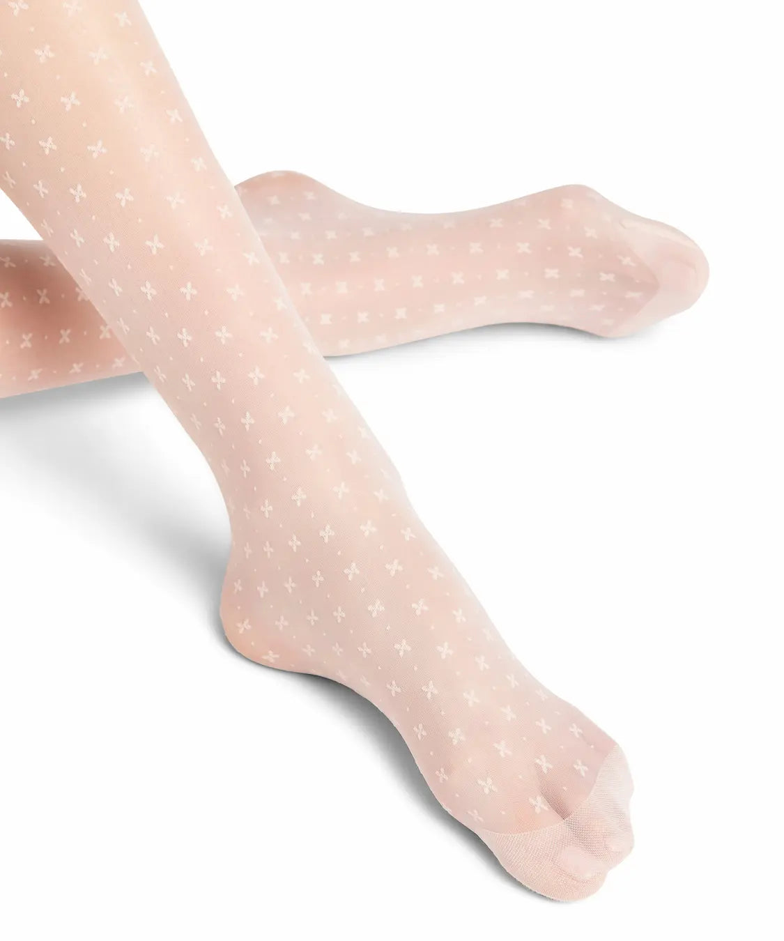 close up of foot of falke bow patterned tights