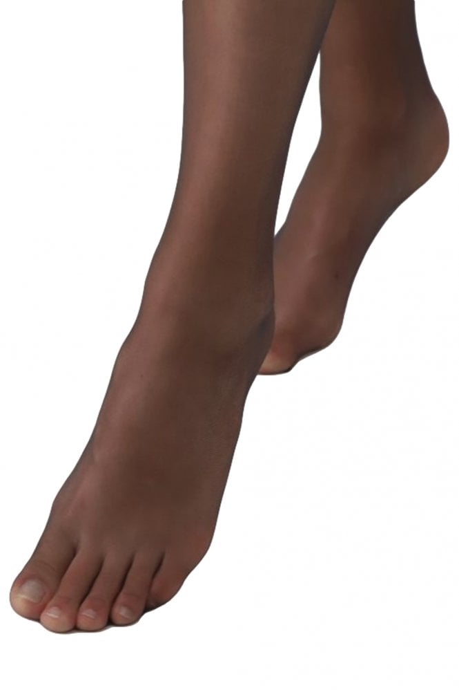 Close-up of a person's feet wearing black tights on a white background