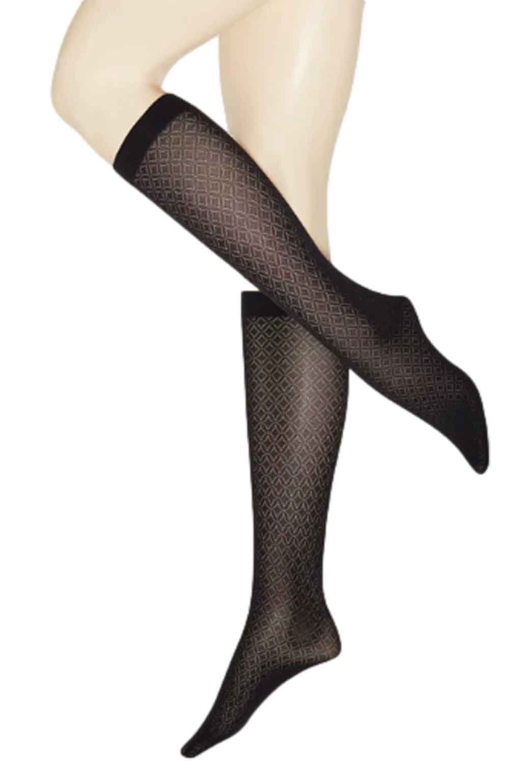 Black 50 denier black  patterned knee highs worn by a model on a white background