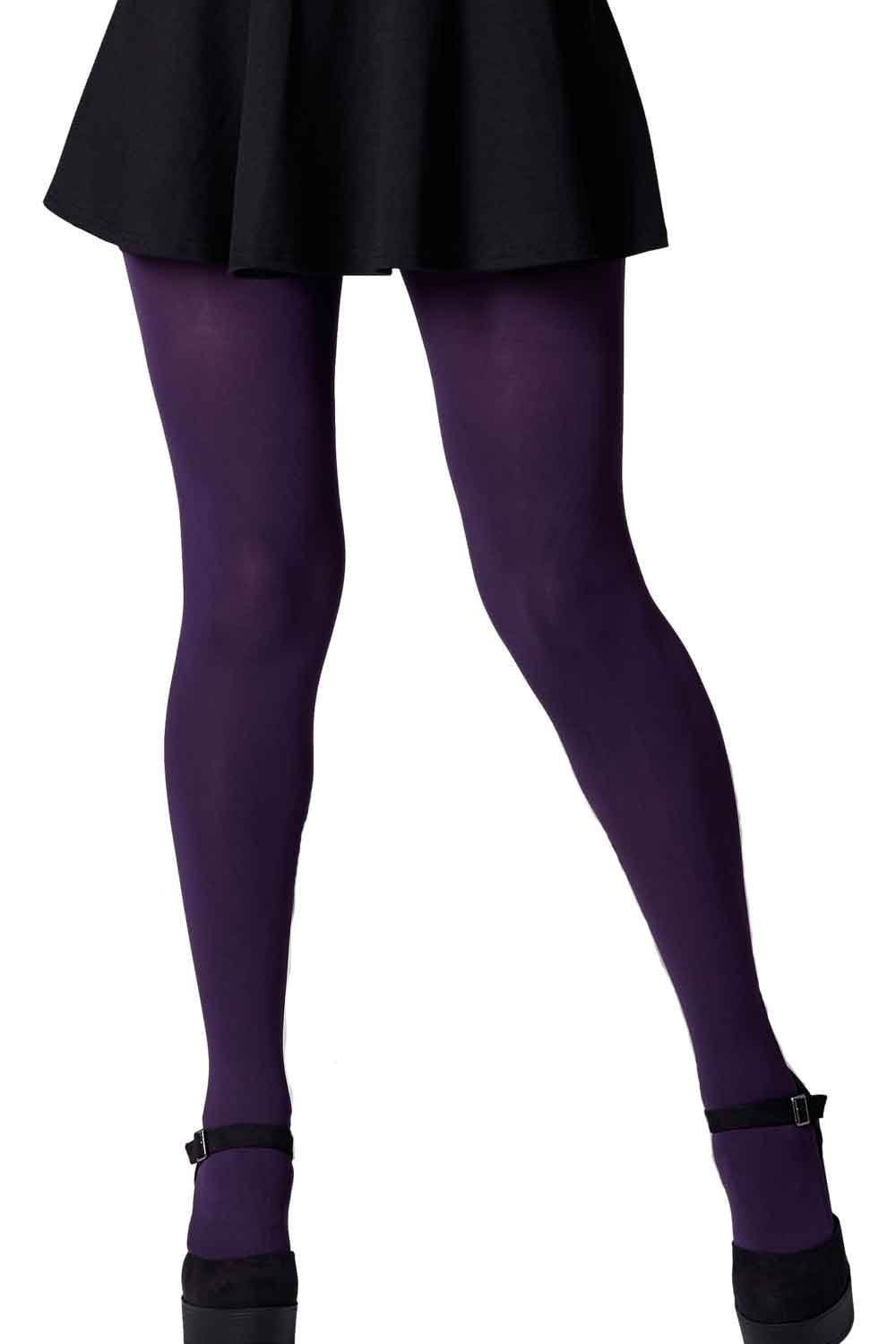 Purple tights worn with a black skirt on a white background