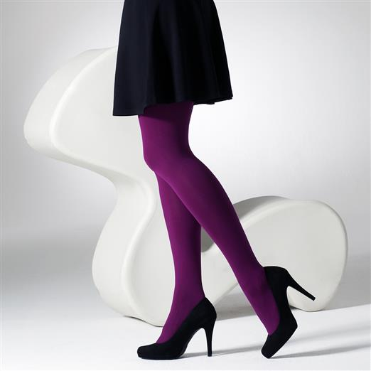 Person wearing purple tights and black high heels on a white background