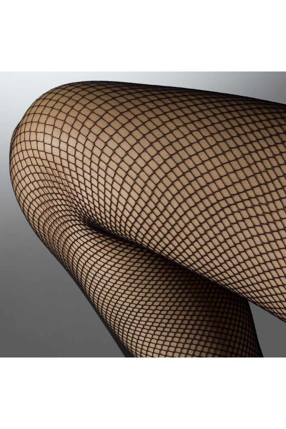 Black fishnet tights on a gray background
