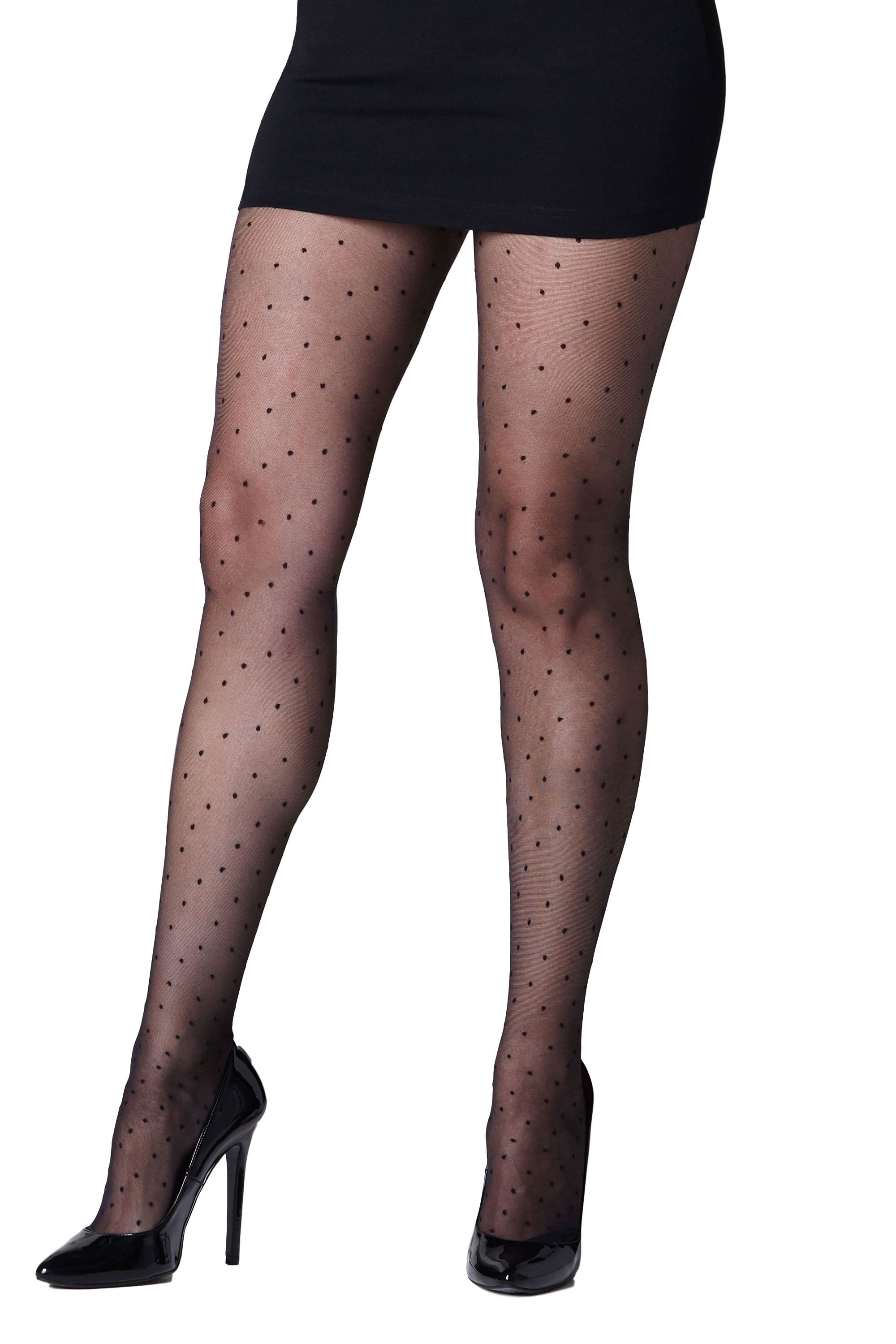 Black polka dot mesh plus size  tights worn with a black skirt and high heels on a white background