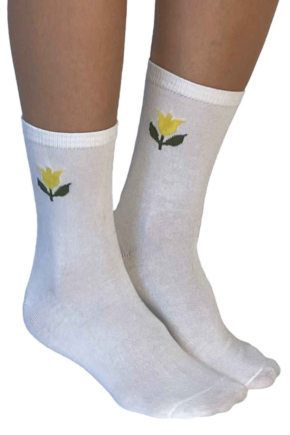 White socks with yellow flower designs on a white background