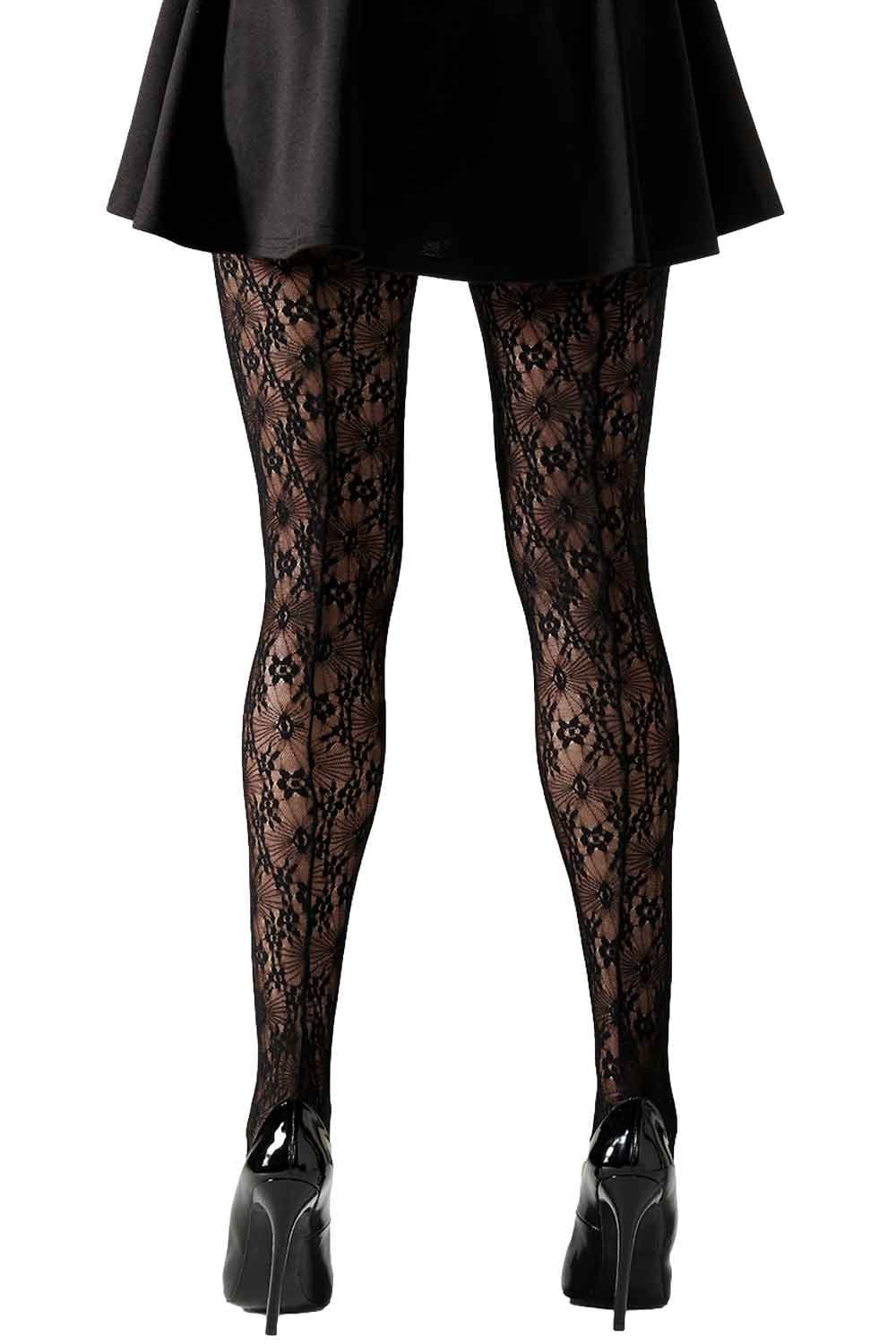 Black lace tights worn with a black skirt and high heels on a white background