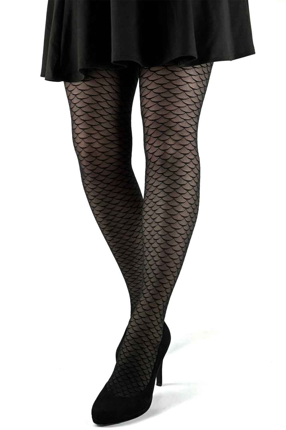 Blackmermaid patterned tights worn with a black skirt and shoes on a white background