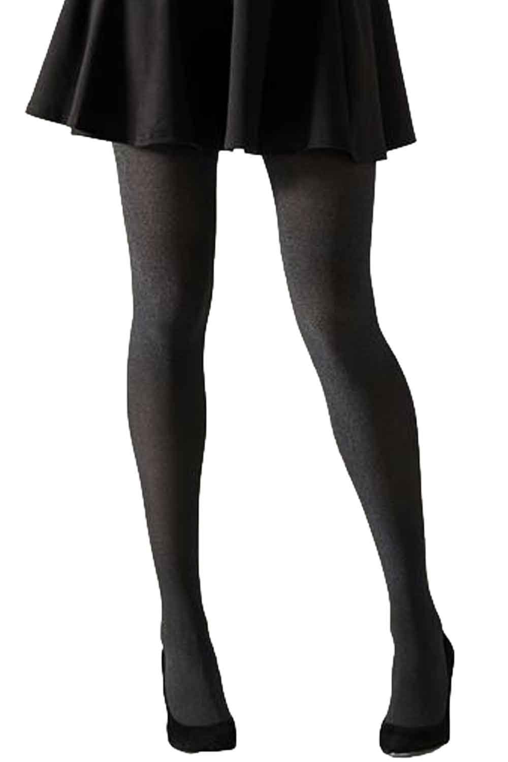 Shimmer  tights worn with a black skirt on a white background