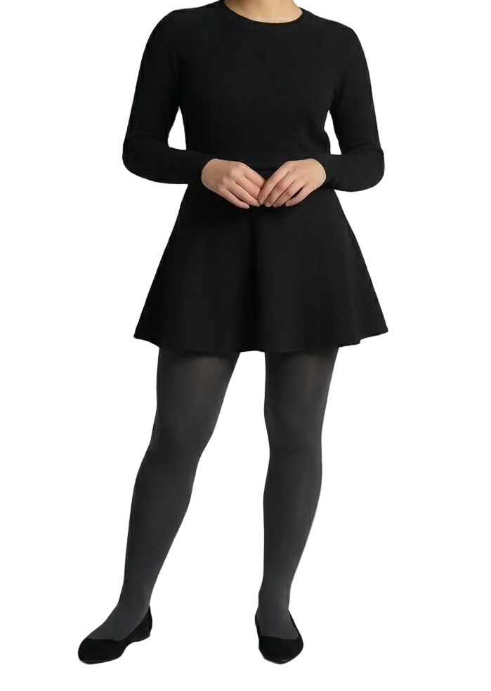 Woman wearing a black dress and tights 