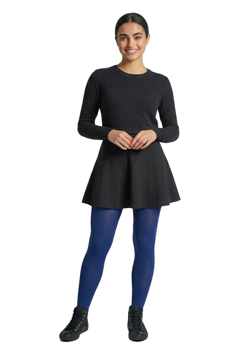 Model wearing Gipsy Twilight Blue Tights with black skirt, top and trainers