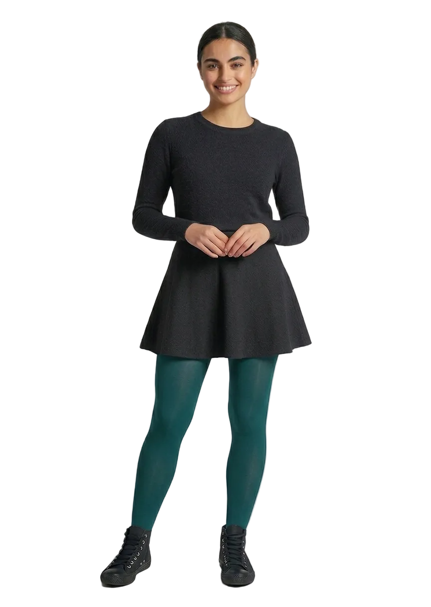 Woman wearing a black dress with green tights